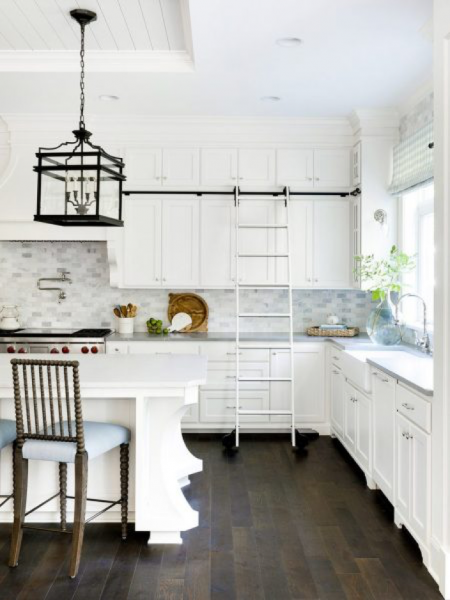 white kitchen with sliding ladder